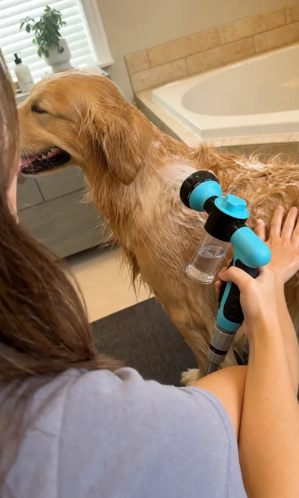 Vantrivo WashPro in use with a golden retriever in a bathroom tub setting